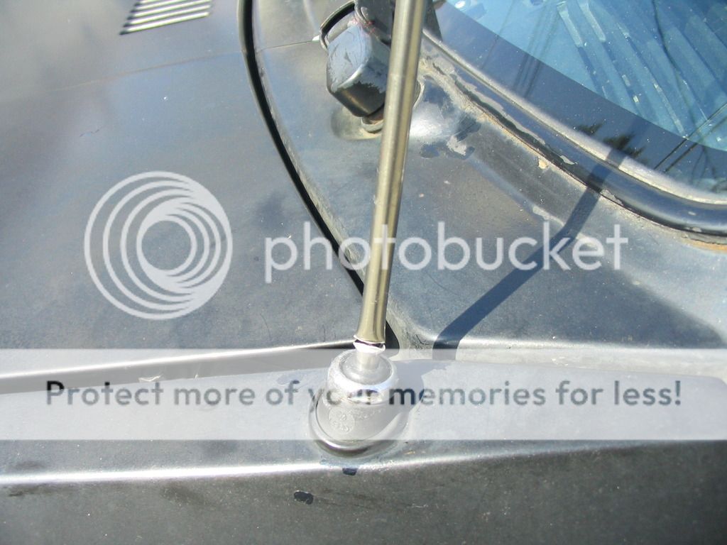 Radio antenna badly bent at car wash